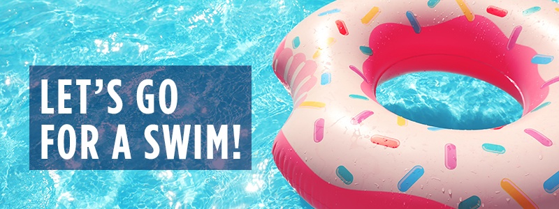 Let's go for a swim! - Pink sprinkled donut pool float floating in the swimming pool