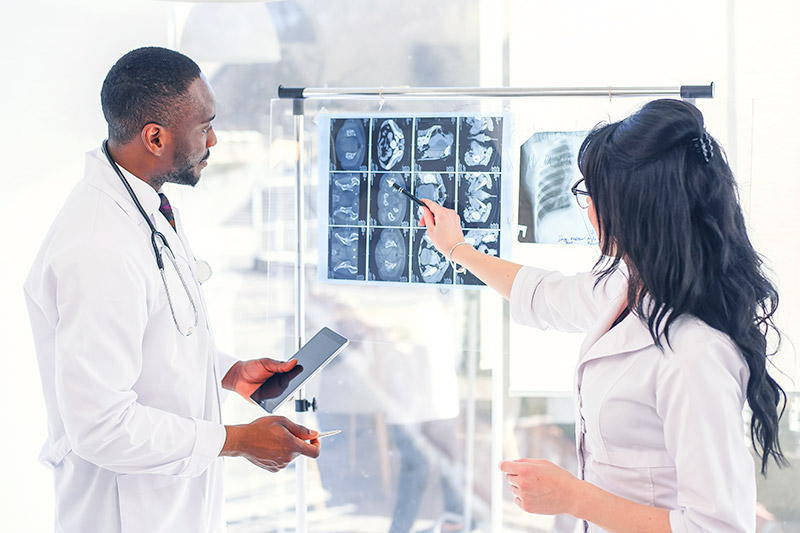 medical staff looking at x-ray