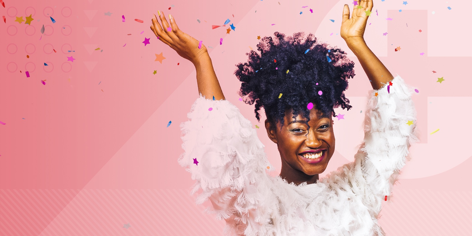 happy, smiling woman celebrating with arms up and throwing confetti