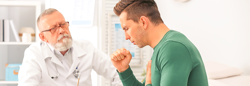 Young man with a respiratory cough visiting doctor