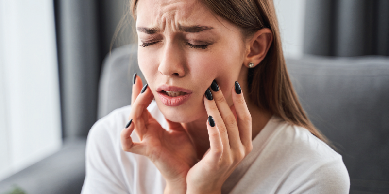 woman with a painful toothache