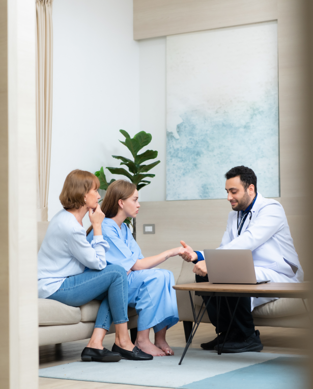 Doctor consulting a patient and family in a modern medical office