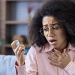Individual showing signs of shortness of breath at home