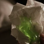 Green mucus on tissue indicating possible infection