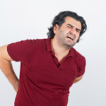 Man holding his middle back in pain.