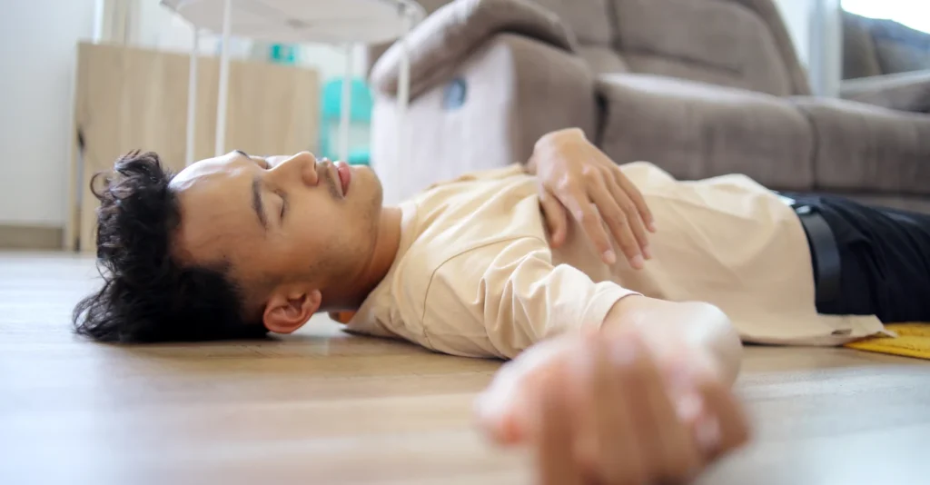 man-passing-out-accident-fainting-falling-floor