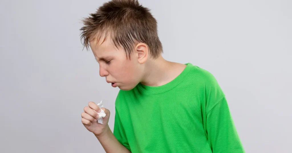 Sick boy coughing from contagious croup