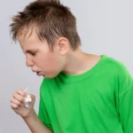 Sick boy coughing from contagious croup